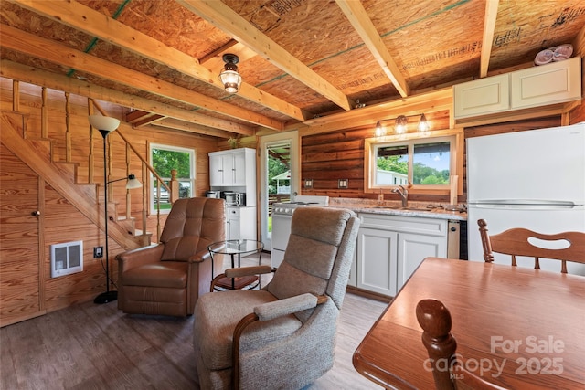 2315 Lanesboro Rd, Marshville, NC 28103 - living room with beam ceiling, stairs, and wood finished floors