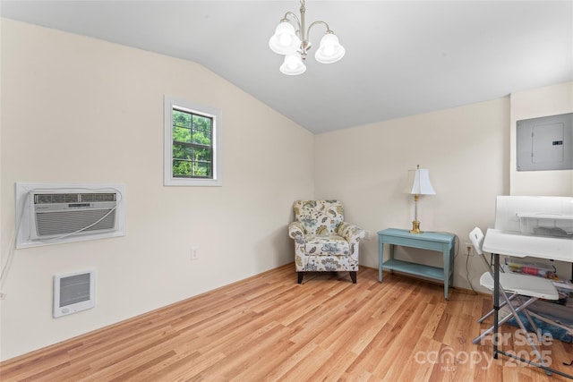 2315 Lanesboro Rd, Marshville, NC 28103 - sitting room featuring heating unit, electric panel, a wall mounted AC, a chandelier, and wood finished floors
