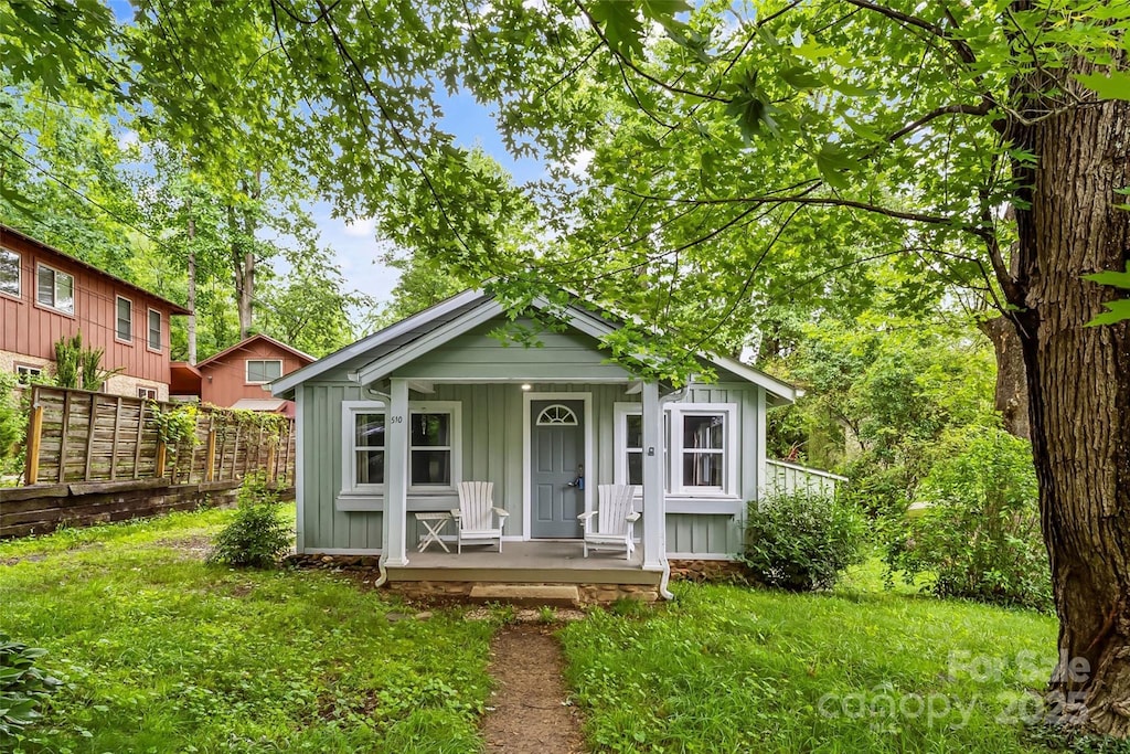 510 Azalea Ave, Black Mountain, NC 28711 - view of front facade featuring board and batten siding and covered porch