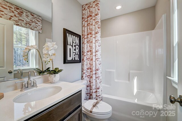 7513 Lancaster Hwy Unit 6, Waxhaw, NC 28173 - bathroom featuring toilet, vanity, shower / bath combo with shower curtain, and recessed lighting