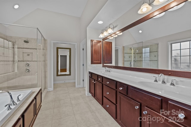 3206 Lakehurst Xing, Matthews, NC 28104 - full bathroom featuring lofted ceiling, a shower stall, double vanity, a garden tub, and tile patterned flooring