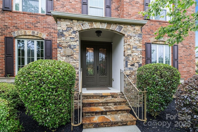 3206 Lakehurst Xing, Matthews, NC 28104 - doorway to property with stone siding, brick siding, and french doors