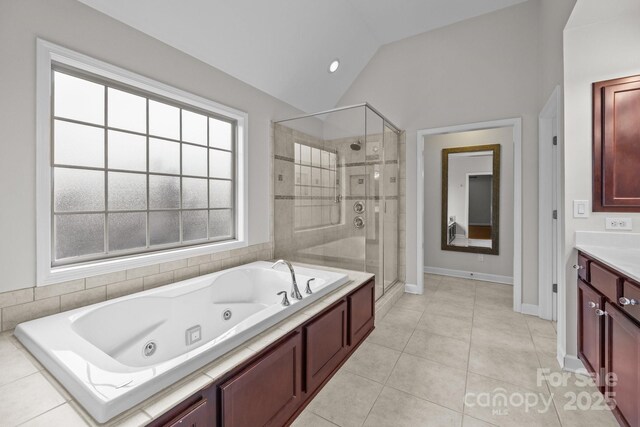 3206 Lakehurst Xing, Matthews, NC 28104 - full bathroom featuring lofted ceiling, a shower stall, a tub with jets, vanity, and tile patterned flooring