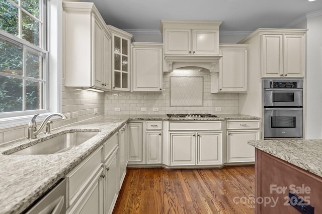 3206 Lakehurst Xing, Matthews, NC 28104 - kitchen featuring stainless steel appliances, a sink, healthy amount of natural light, dark wood-style floors, and crown molding