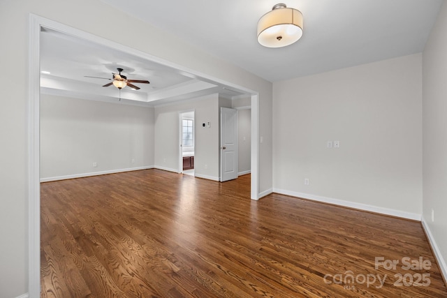 3206 Lakehurst Xing, Matthews, NC 28104 - empty room featuring ceiling fan, wood finished floors, baseboards, a tray ceiling, and crown molding