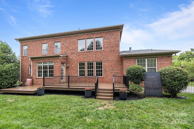 3206 Lakehurst Xing, Matthews, NC 28104 - rear view of house featuring brick siding, a lawn, and a wooden deck