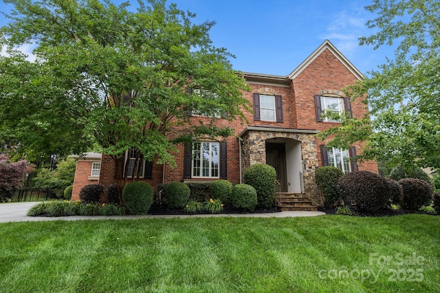 3206 Lakehurst Xing, Matthews, NC 28104 - view of front facade with a front lawn and brick siding