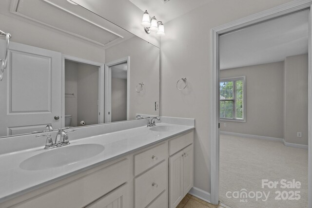 3206 Lakehurst Xing, Matthews, NC 28104 - full bath featuring double vanity, toilet, and baseboards