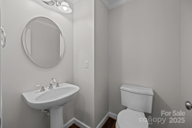 3206 Lakehurst Xing, Matthews, NC 28104 - bathroom featuring toilet, crown molding, wood finished floors, and baseboards