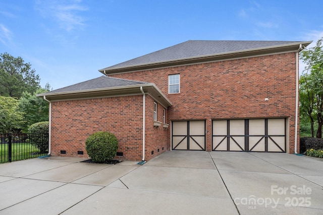 3206 Lakehurst Xing, Matthews, NC 28104 - view of home's exterior featuring concrete driveway, an attached garage, crawl space, and brick siding
