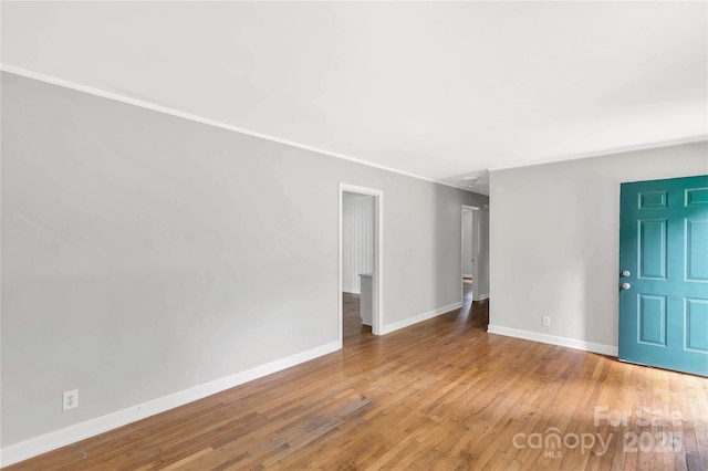405 N Woodland Dr, Lancaster, SC 29720 - unfurnished room featuring baseboards, hardwood / wood-style flooring, and ornamental molding