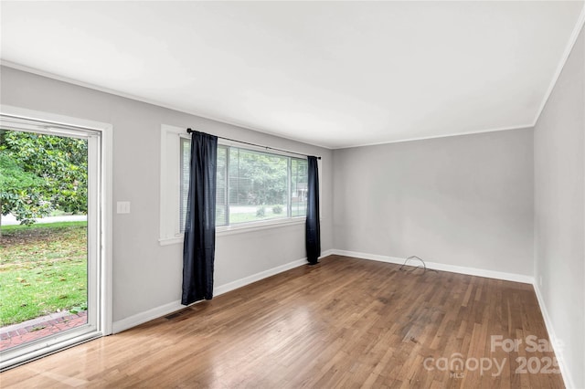 405 N Woodland Dr, Lancaster, SC 29720 - unfurnished room with plenty of natural light, wood finished floors, and baseboards