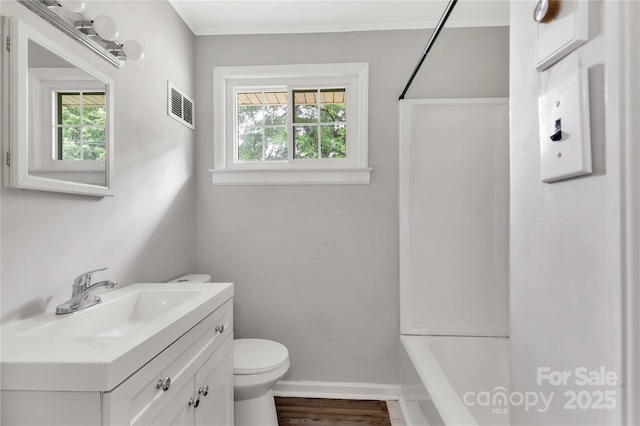 405 N Woodland Dr, Lancaster, SC 29720 - full bath with toilet, vanity, baseboards, bathing tub / shower combination, and ornamental molding
