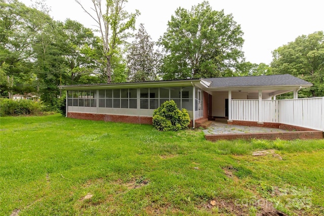 405 N Woodland Dr, Lancaster, SC 29720 - back of property featuring a sunroom and a lawn