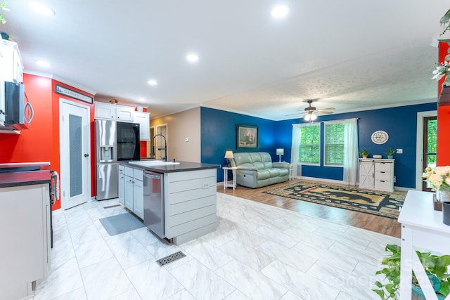 225 Opal Dr, Whittier, NC 28789 - kitchen with a sink, stainless steel appliances, white cabinetry, plenty of natural light, and recessed lighting