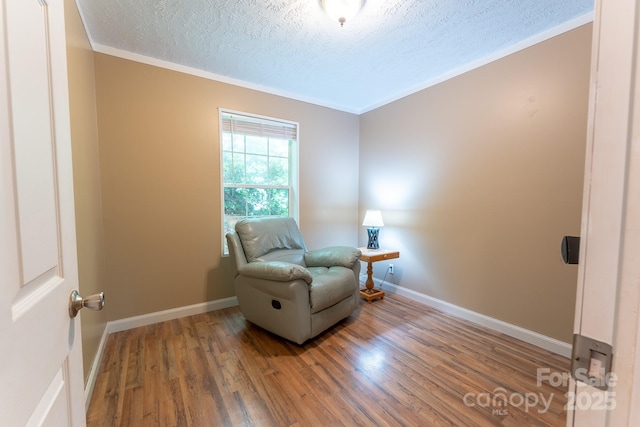 225 Opal Dr, Whittier, NC 28789 - sitting room with crown molding, a textured ceiling, wood finished floors, and baseboards