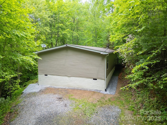 225 Opal Dr, Whittier, NC 28789 - view of side of home featuring crawl space and a wooded view