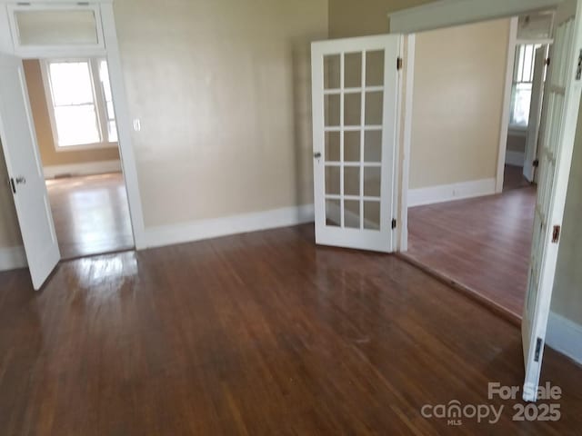 607 Lee Ave, Wadesboro, NC 28170 - empty room featuring wood finished floors, baseboards, and french doors