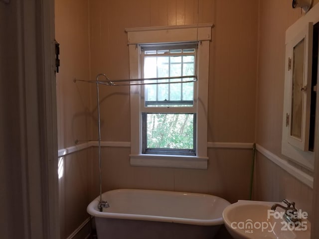 607 Lee Ave, Wadesboro, NC 28170 - full bath with healthy amount of natural light, a soaking tub, and a sink