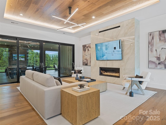 63 Running Creek Trl, Arden, NC 28704 - living room with wood finished floors, a fireplace, wooden ceiling, plenty of natural light, and recessed lighting