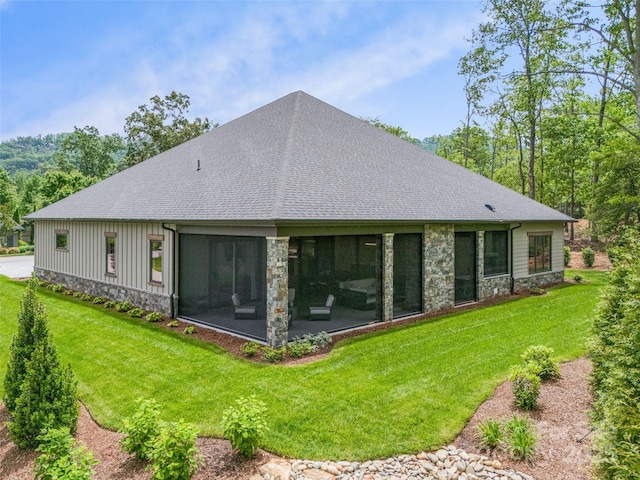 63 Running Creek Trl, Arden, NC 28704 - rear view of house featuring stone siding, a yard, and roof with shingles
