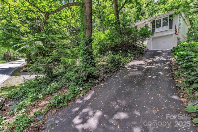 35 Avondale Rd, Asheville, NC 28803 - view of side of home with asphalt driveway and a garage