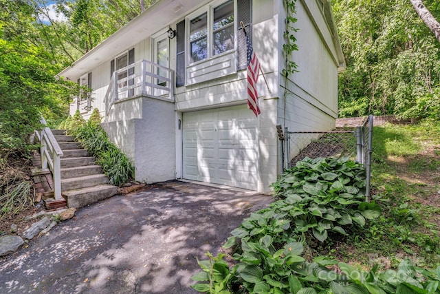 35 Avondale Rd, Asheville, NC 28803 - view of property exterior with a garage, driveway, and stairway