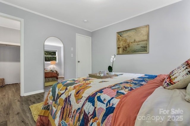 35 Avondale Rd, Asheville, NC 28803 - bedroom with wood finished floors, ornamental molding, baseboards, and arched walkways