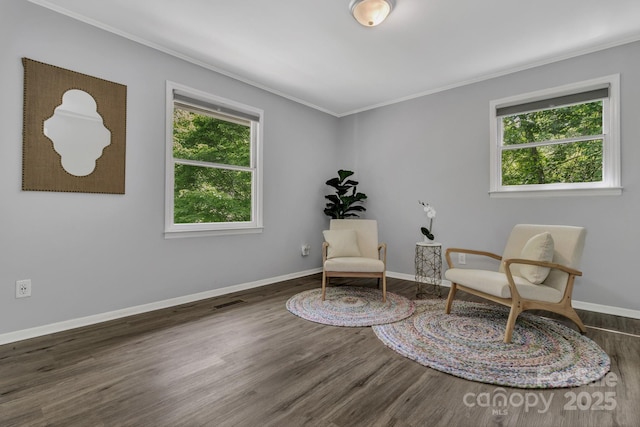35 Avondale Rd, Asheville, NC 28803 - living area featuring healthy amount of natural light, ornamental molding, wood finished floors, and baseboards