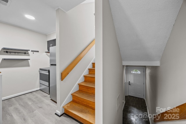 415 W 7th St Unit H, Charlotte, NC 28202 - staircase featuring baseboards, wood finished floors, and recessed lighting