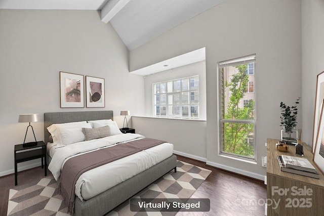 415 W 7th St Unit H, Charlotte, NC 28202 - bedroom with beamed ceiling, high vaulted ceiling, wood finished floors, and baseboards