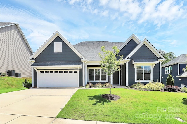 163 Crenshaw Pl NW, Concord, NC 28027 - view of front facade with a front yard, central AC unit, driveway, and an attached garage