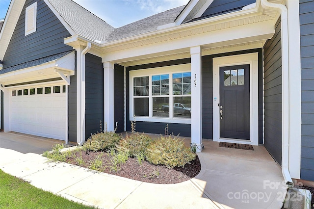 163 Crenshaw Pl NW, Concord, NC 28027 - property entrance featuring covered porch, roof with shingles, and concrete driveway