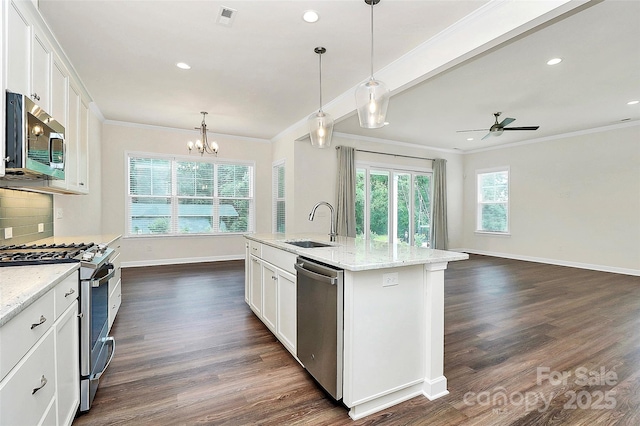 163 Crenshaw Pl NW, Concord, NC 28027 - kitchen featuring appliances with stainless steel finishes, crown molding, baseboards, a sink, and ceiling fan
