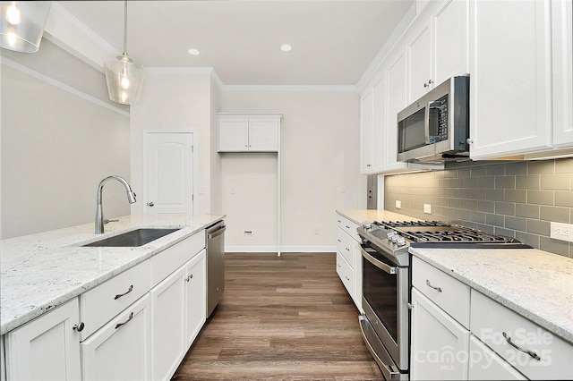 163 Crenshaw Pl NW, Concord, NC 28027 - kitchen with appliances with stainless steel finishes, a sink, dark wood-type flooring, white cabinetry, and crown molding