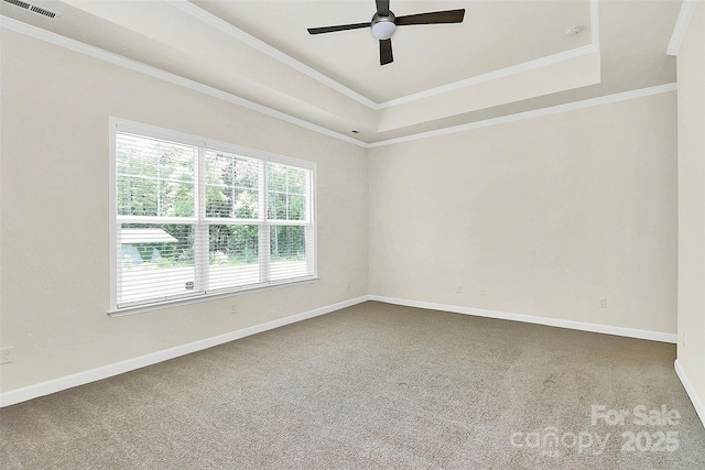 163 Crenshaw Pl NW, Concord, NC 28027 - carpeted empty room with a ceiling fan, baseboards, ornamental molding, and a raised ceiling