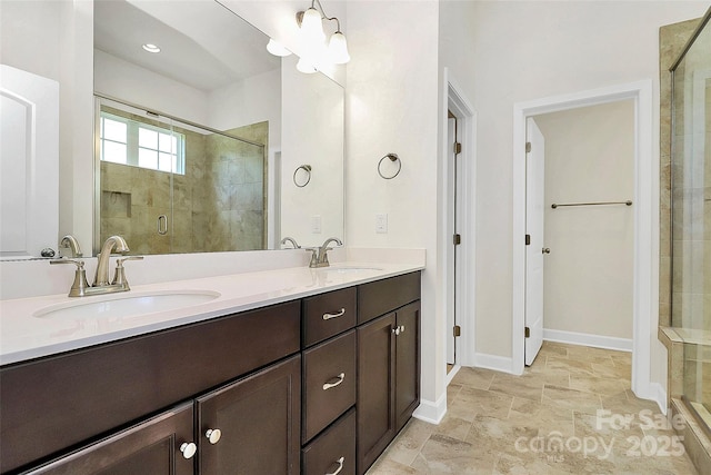 163 Crenshaw Pl NW, Concord, NC 28027 - full bathroom featuring a shower stall, double vanity, and baseboards