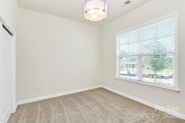 163 Crenshaw Pl NW, Concord, NC 28027 - unfurnished room featuring plenty of natural light, carpet flooring, and baseboards