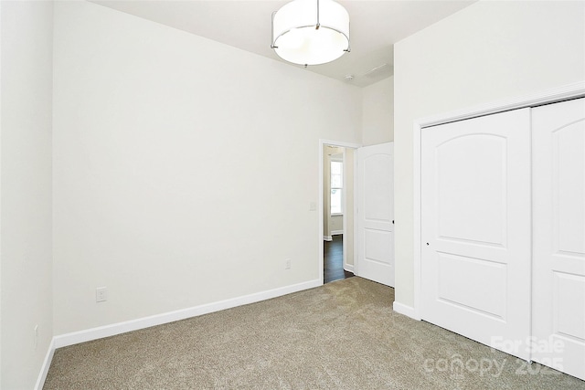 163 Crenshaw Pl NW, Concord, NC 28027 - unfurnished bedroom featuring carpet floors, baseboards, and a closet