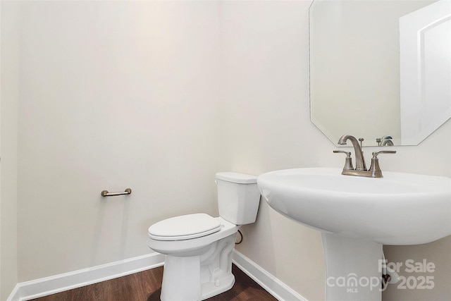 163 Crenshaw Pl NW, Concord, NC 28027 - half bath with baseboards, toilet, and wood finished floors