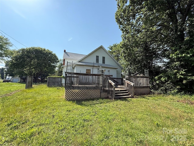 1445 33rd St SW, Hickory, NC 28602 - rear view of property featuring a lawn, a wooden deck, and a chimney