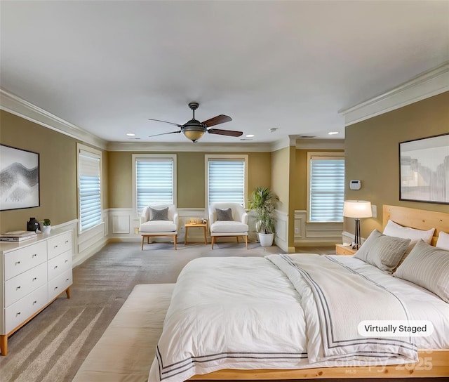 bedroom with ornamental molding, light carpet, a decorative wall, a wainscoted wall, and recessed lighting