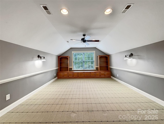 additional living space with a ceiling fan, baseboards, light carpet, vaulted ceiling, and recessed lighting