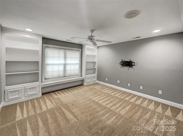 empty room featuring carpet floors, ceiling fan, baseboards, built in features, and recessed lighting