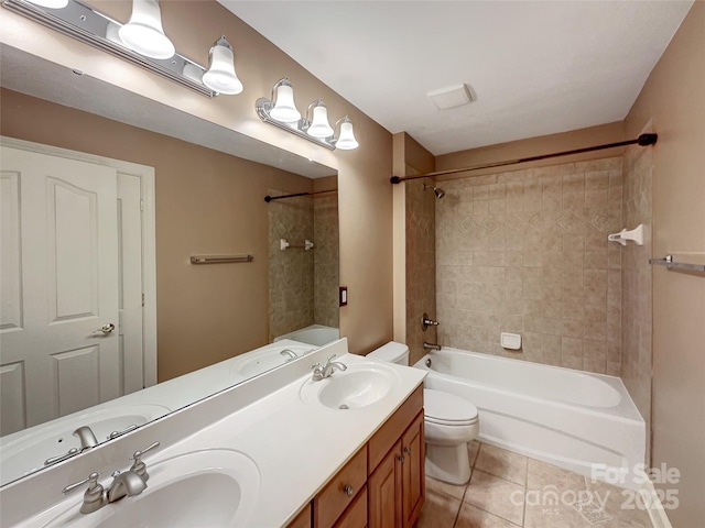 bathroom with toilet, tile patterned flooring, washtub / shower combination, and double vanity