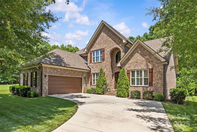 6211 Cruden Bay Way, Charlotte, NC 28277 - traditional home featuring driveway, a front yard, an attached garage, brick siding, and roof with shingles
