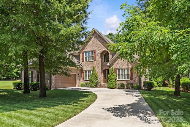 6211 Cruden Bay Way, Charlotte, NC 28277 - traditional home with driveway, a front lawn, an attached garage, and brick siding