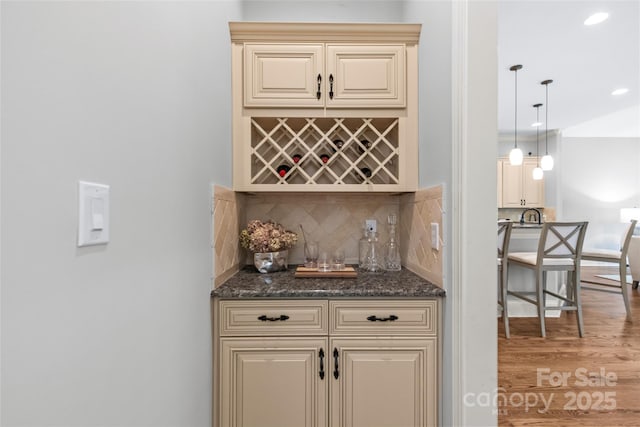 6211 Cruden Bay Way, Charlotte, NC 28277 - indoor dry bar featuring backsplash, light wood-type flooring, recessed lighting, and hanging light fixtures
