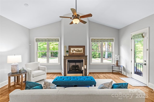 6211 Cruden Bay Way, Charlotte, NC 28277 - living area with healthy amount of natural light, a fireplace, ceiling fan, and lofted ceiling