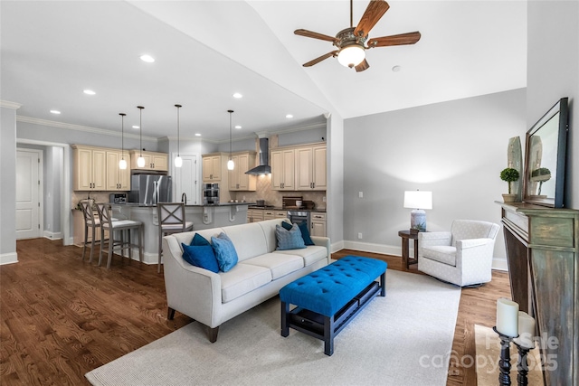 6211 Cruden Bay Way, Charlotte, NC 28277 - living area with ceiling fan, wood finished floors, recessed lighting, ornamental molding, and lofted ceiling